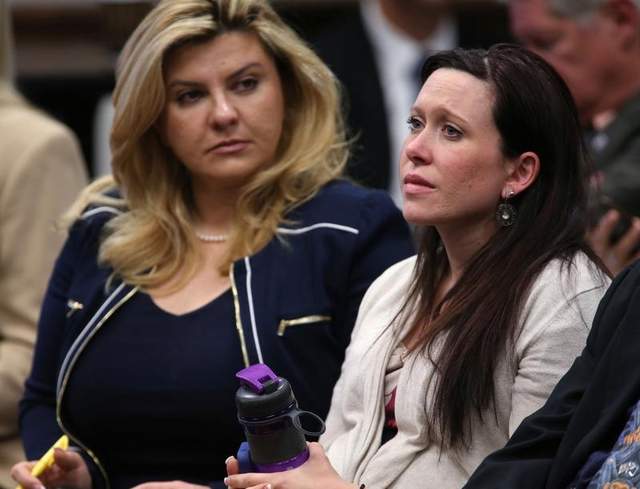 Assemblywoman Michelle Fiore, left, and Amanda Collins listen to testimony on a bill that would allow permit holders to carry their guns on college campuses during a hearing at the Legislative Building on April 3, 2013. (AP Photo/Cathleen Allison)